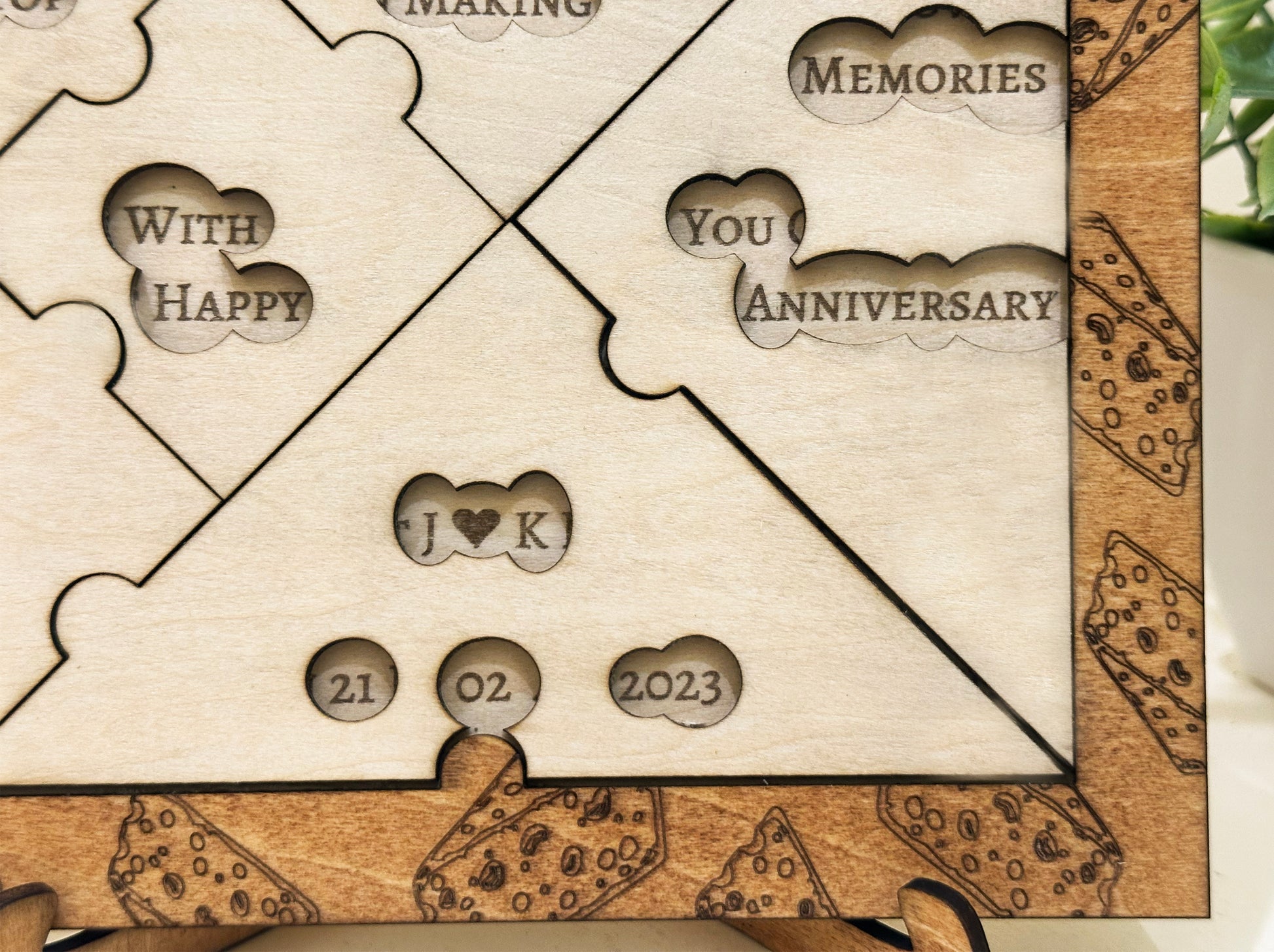 Wooden anniversary puzzle with engraved text and dates