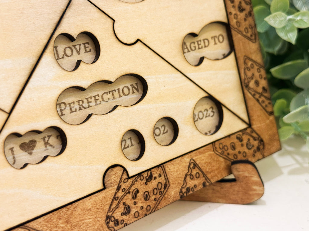 Wooden puzzle piece with custom engraved text and dates