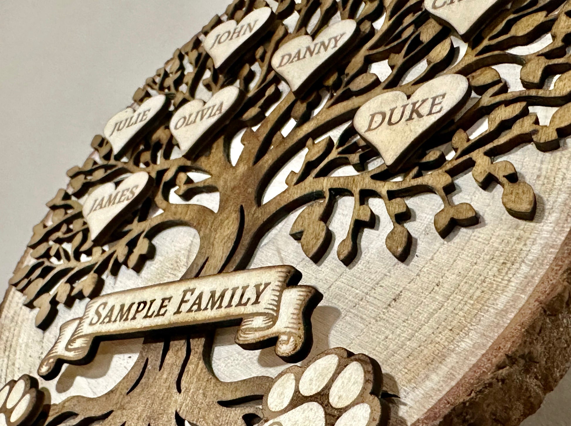 Wooden family tree with engraved names and 'cUSTOM FAMILY NAME' 